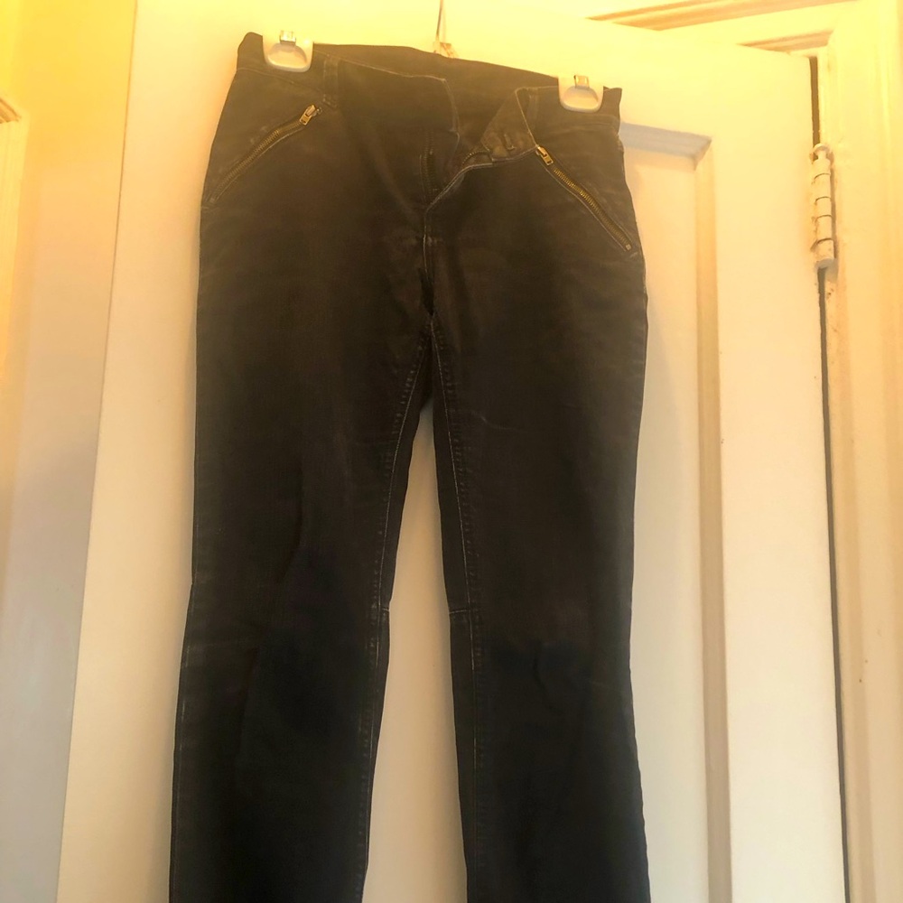 Black jeans with zipper pockets and legs